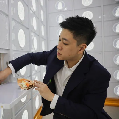 Kenneth Yeow tending to a columbarium niche